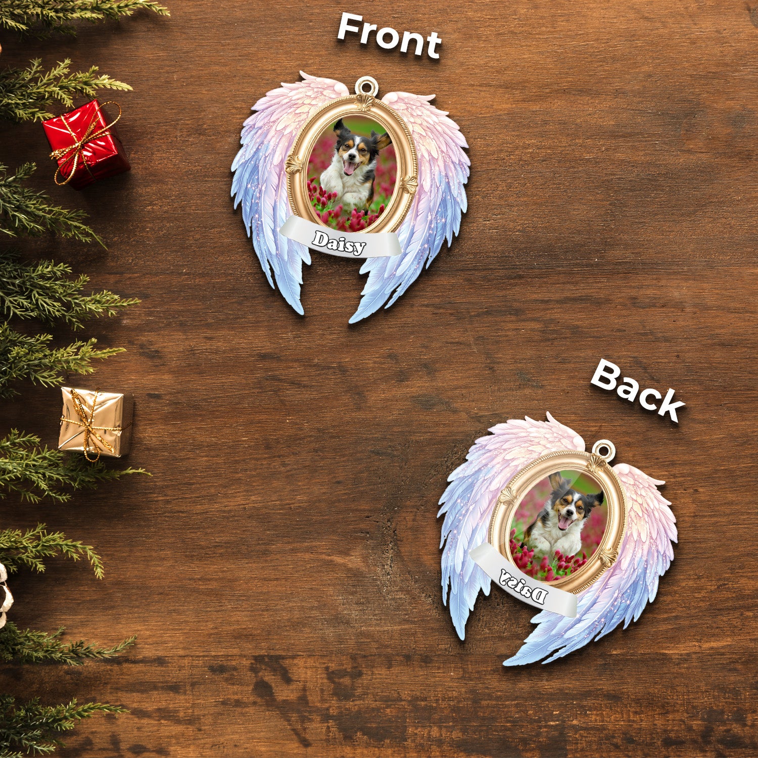 Decorative angel wing ornament with a dog photo on a wooden surface with Christmas decorations.